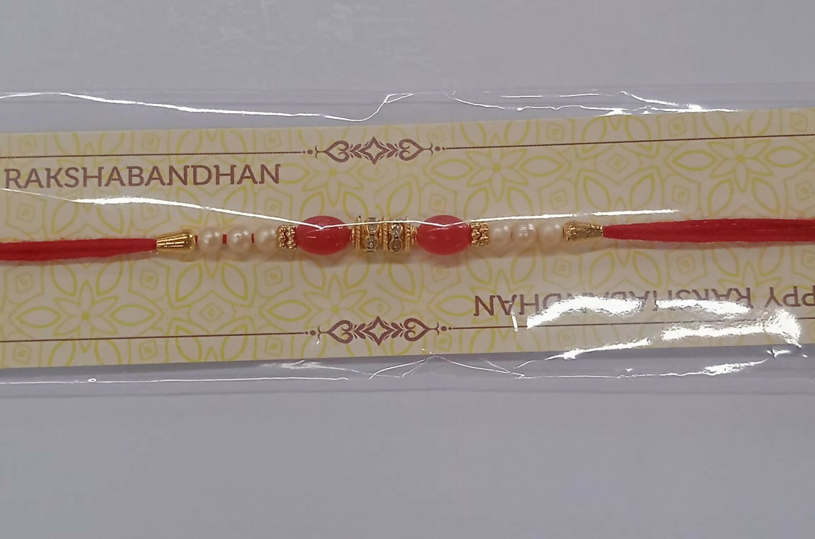 Traditional Pearl Beaded Rakhi With Red Beads Golden Accents Elegant Raksha Bandhan Thread For Brother