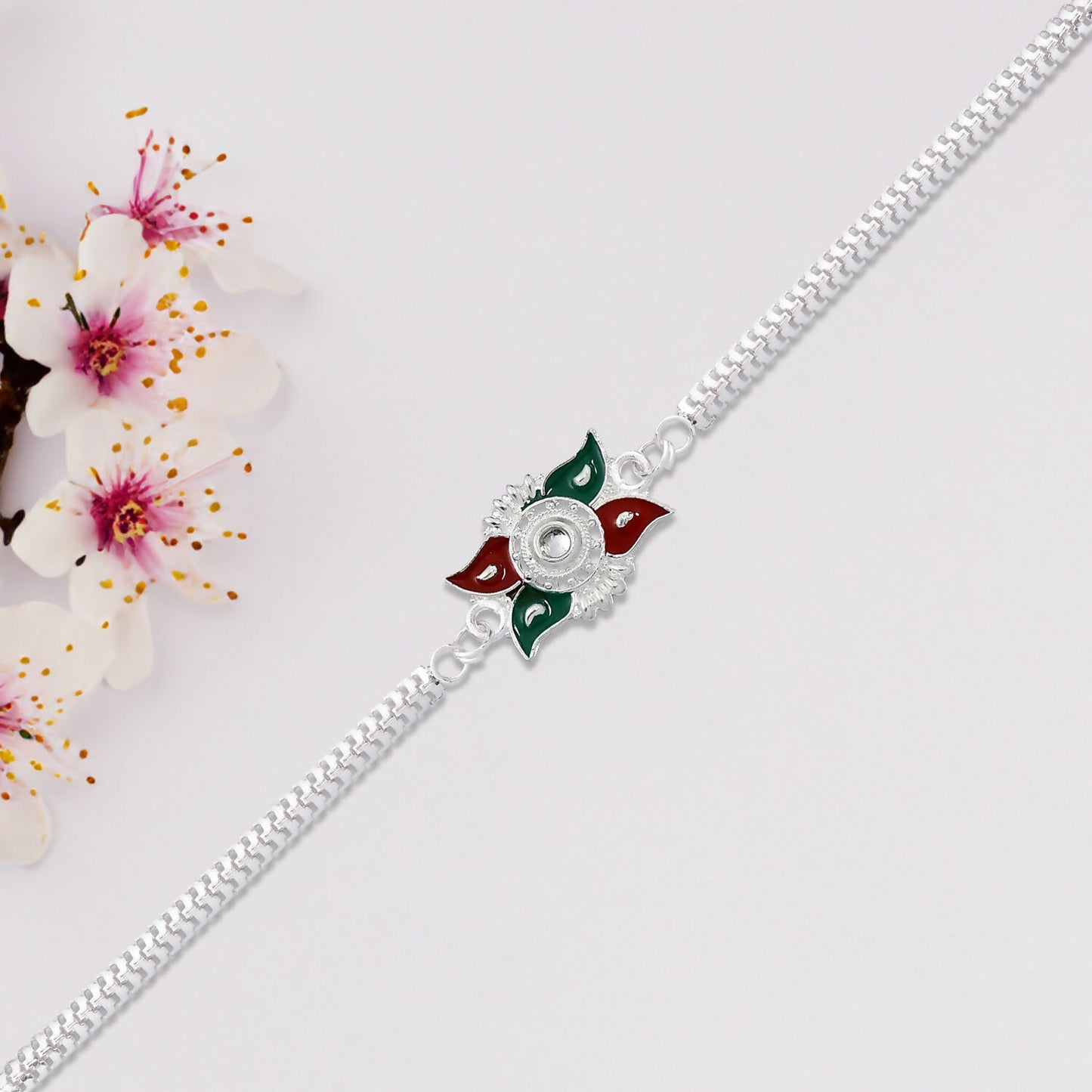 Elegant Silver Chain Rakhi With Red-green Enamel Floral Design For Brother