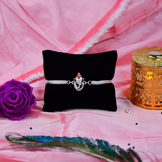 Stylish Ganesha Rakhi With Enamel Highlights And Silver Metal Chain