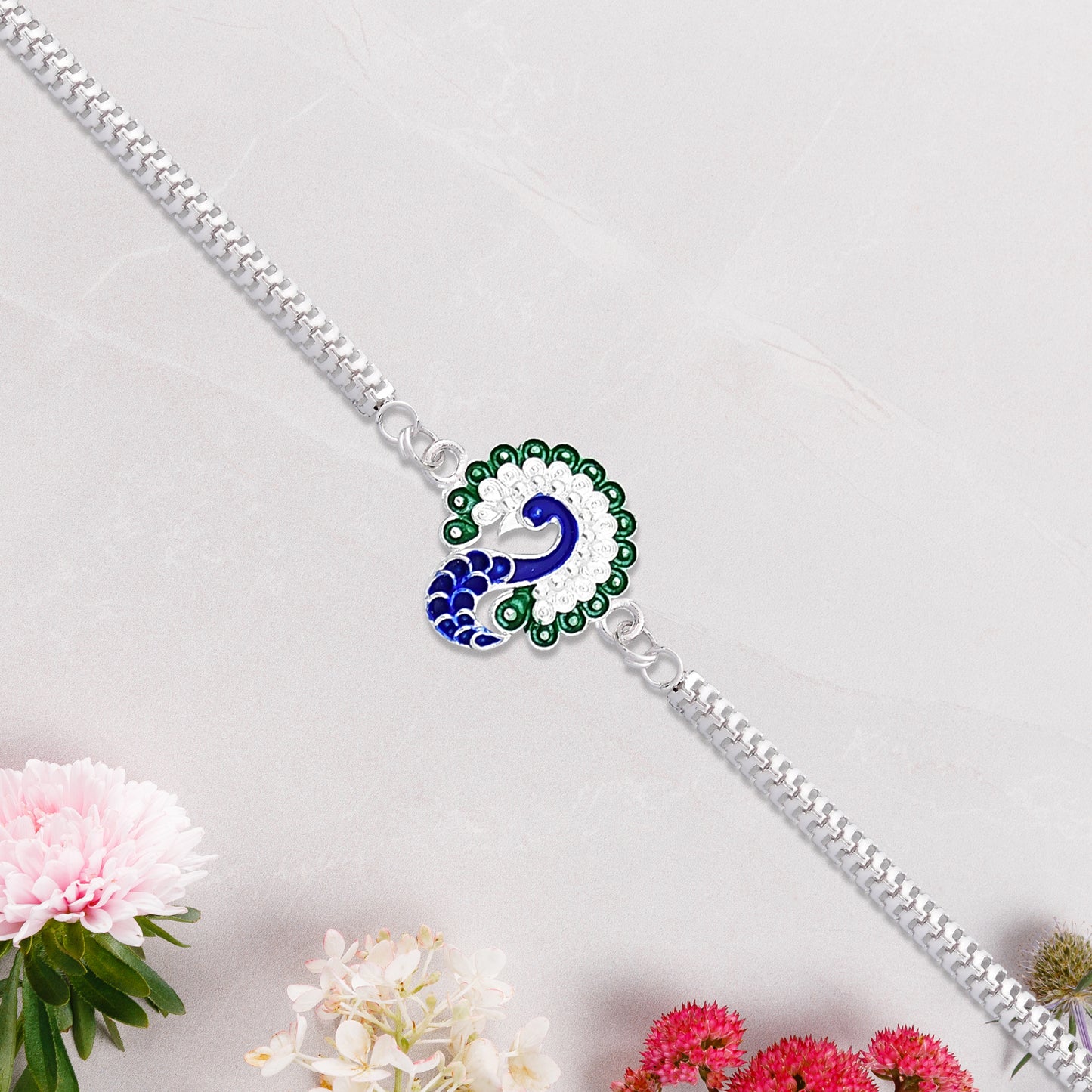 Peacock Design Metal Chain Rakhi With Blue Green And White Stone Work