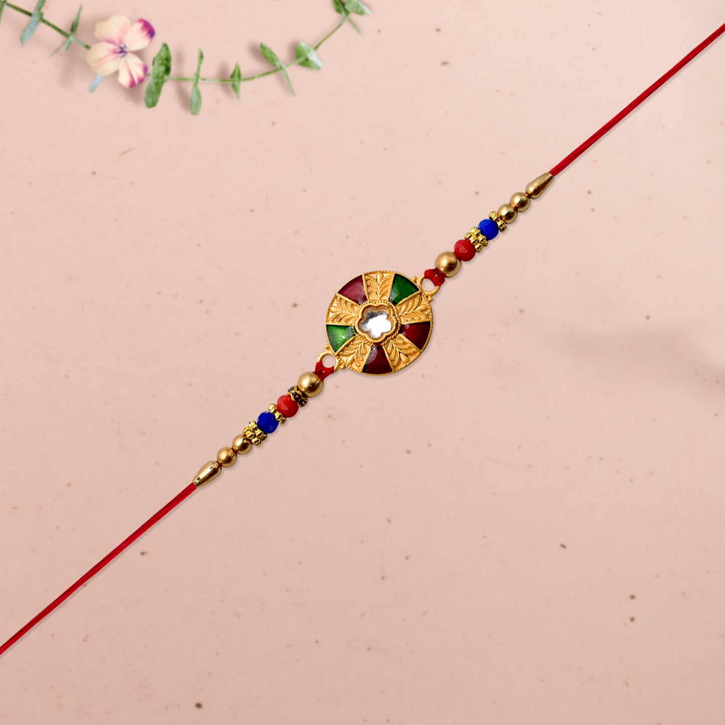 Elegant Multicolor Kundan Rakhi With Golden Floral Round Dial And Beaded Red Thread